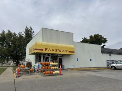 Exterior view of a Fareway store with pumpkins displayed outside.