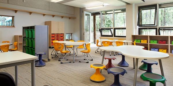 Classroom furniture with compass chairs and Hokki stools.