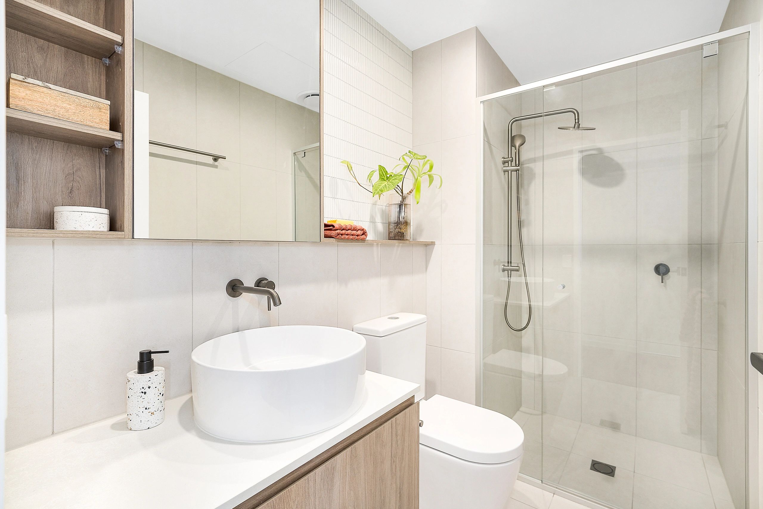 Bathroom with tiled finishes and generous vanity