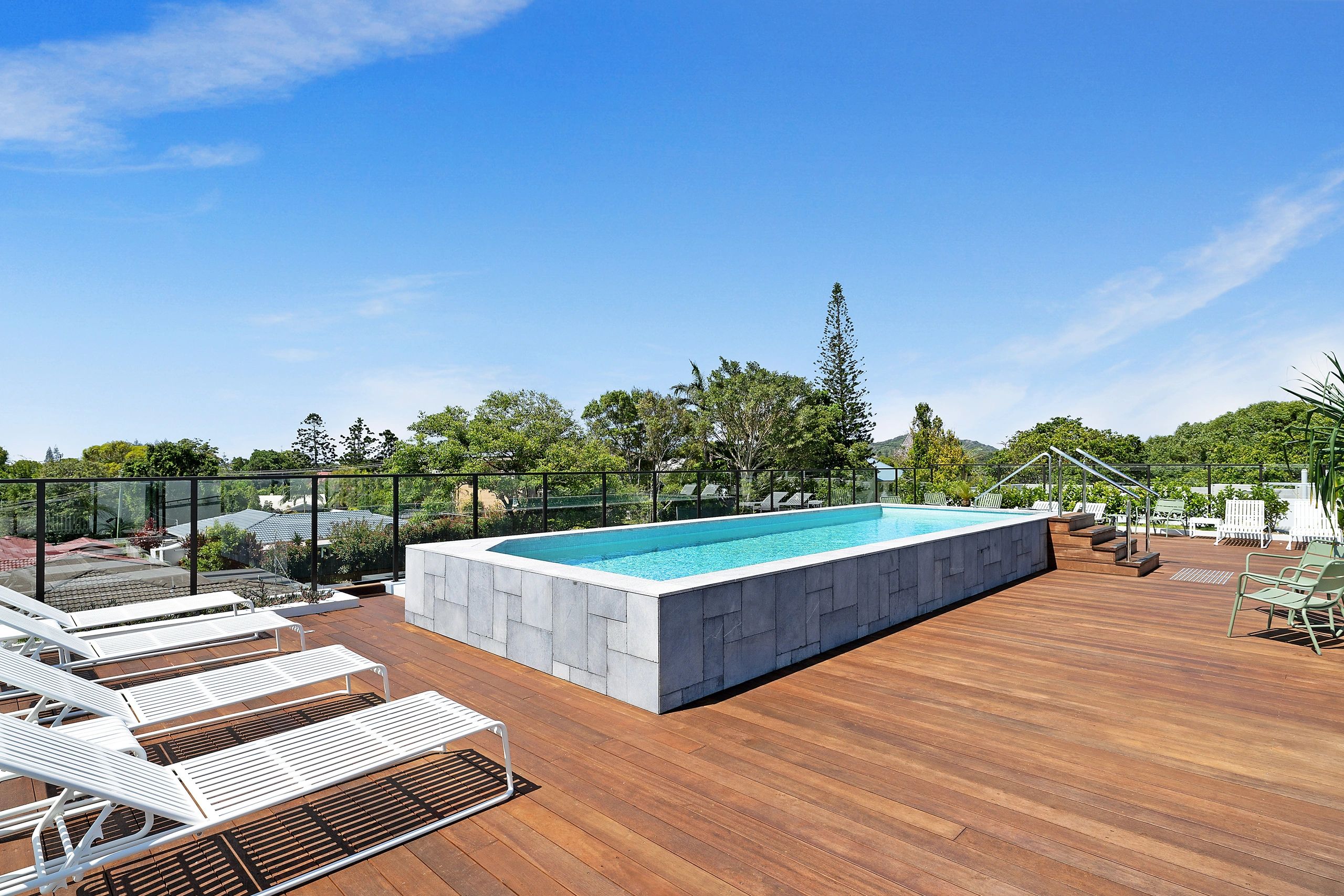 Shared heated rooftop pool and terrace of the building
