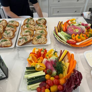 vibrant crudité platter with fresh vegetables and gourmet sandwiches, for events or healthy snacks