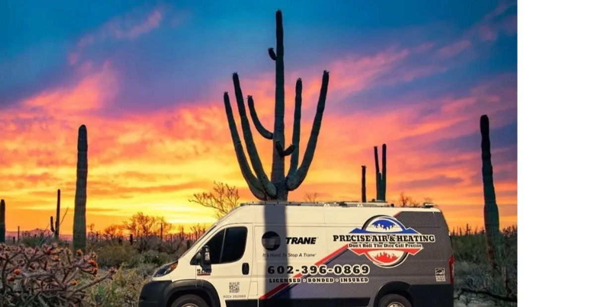 Precise Air & Heating service van parked in front of homeowners with a sunset and cactus