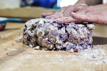Scone dough being mixed by hand.