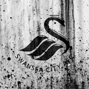 Swansea City AFC logo on a weathered surface.