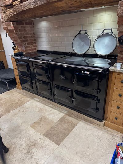Black vintage-style AGA stove with multiple compartments in a rustic kitchen.

Grease wizards oven cleaning Loughborough, Professional oven cleaning
