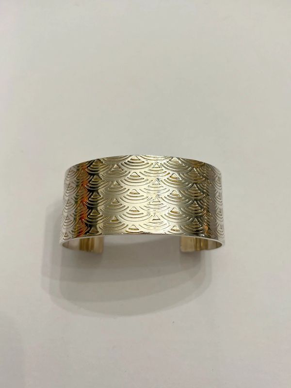 Textured wide band gold ring.