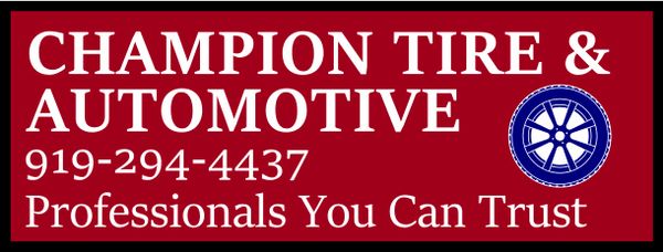 Champion Tire &amp; Automotive business sign with contact info and logo.