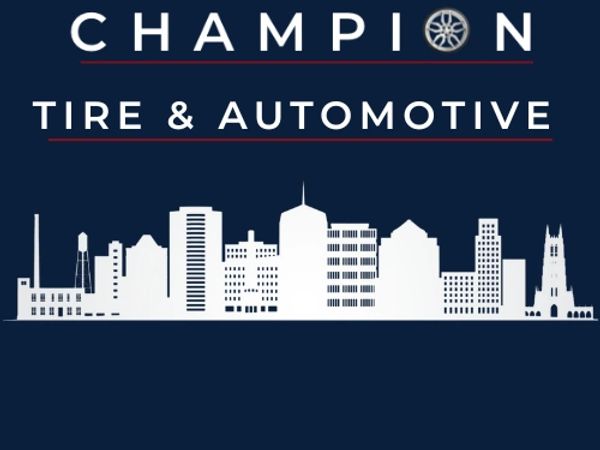 Logo of Champion Tire &amp; Automotive with a city skyline silhouette.
