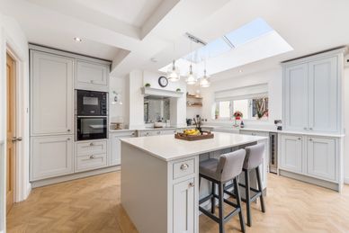 Bright modern kitchen with large island and skylight.