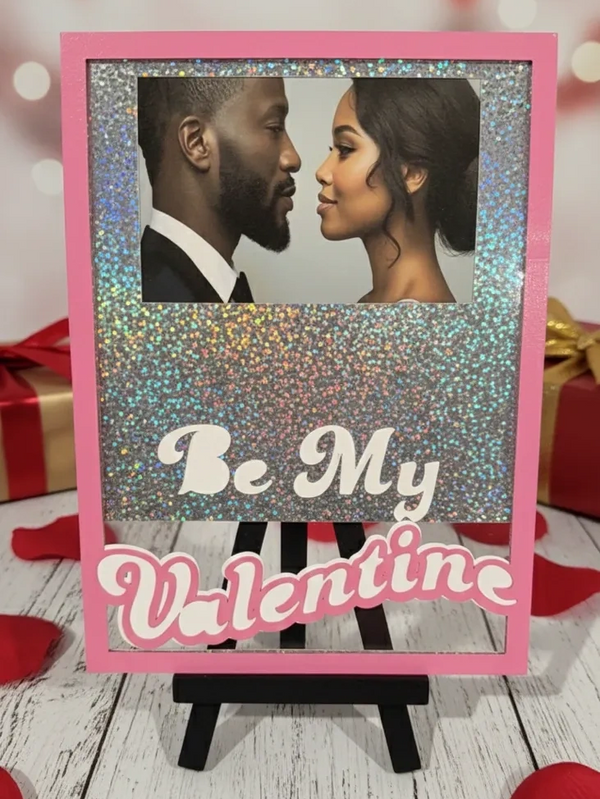 Romantic Valentine’s Day photo frame with a couple and glittery background.