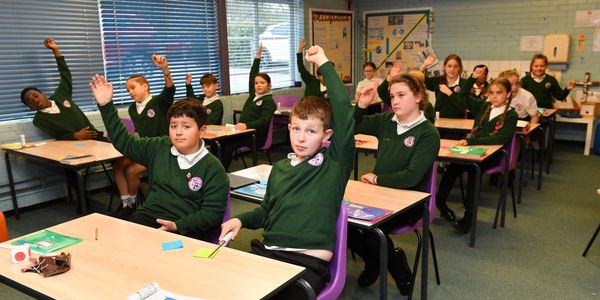KS2 children engaging with a financial education workshop on budgeting. 