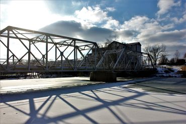 Bridge over an icy river- Ozark Mill, Ozark Missouri. 