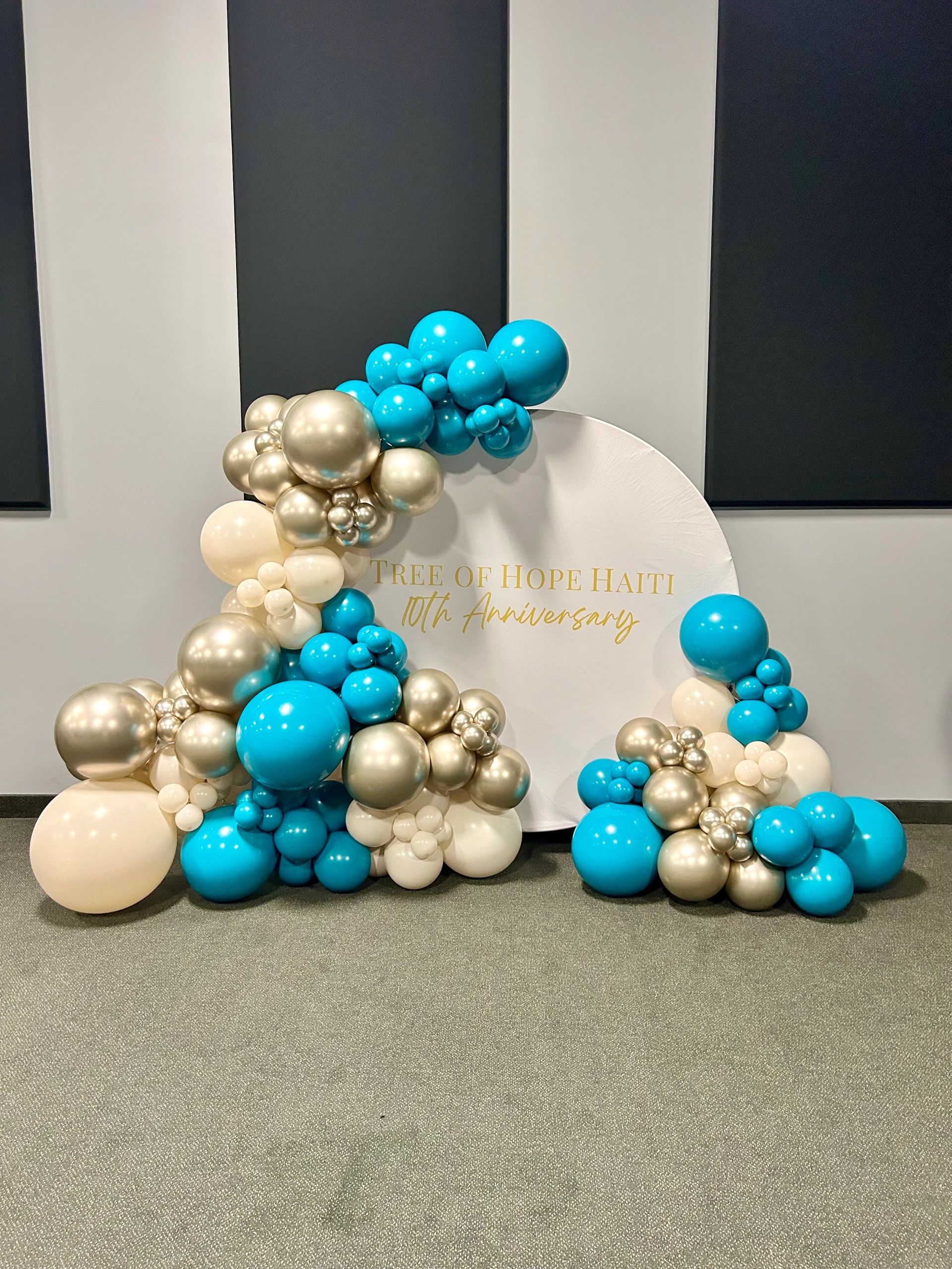 Colorful balloon arrangement for Tree of Hope Haiti's 10th anniversary celebration.