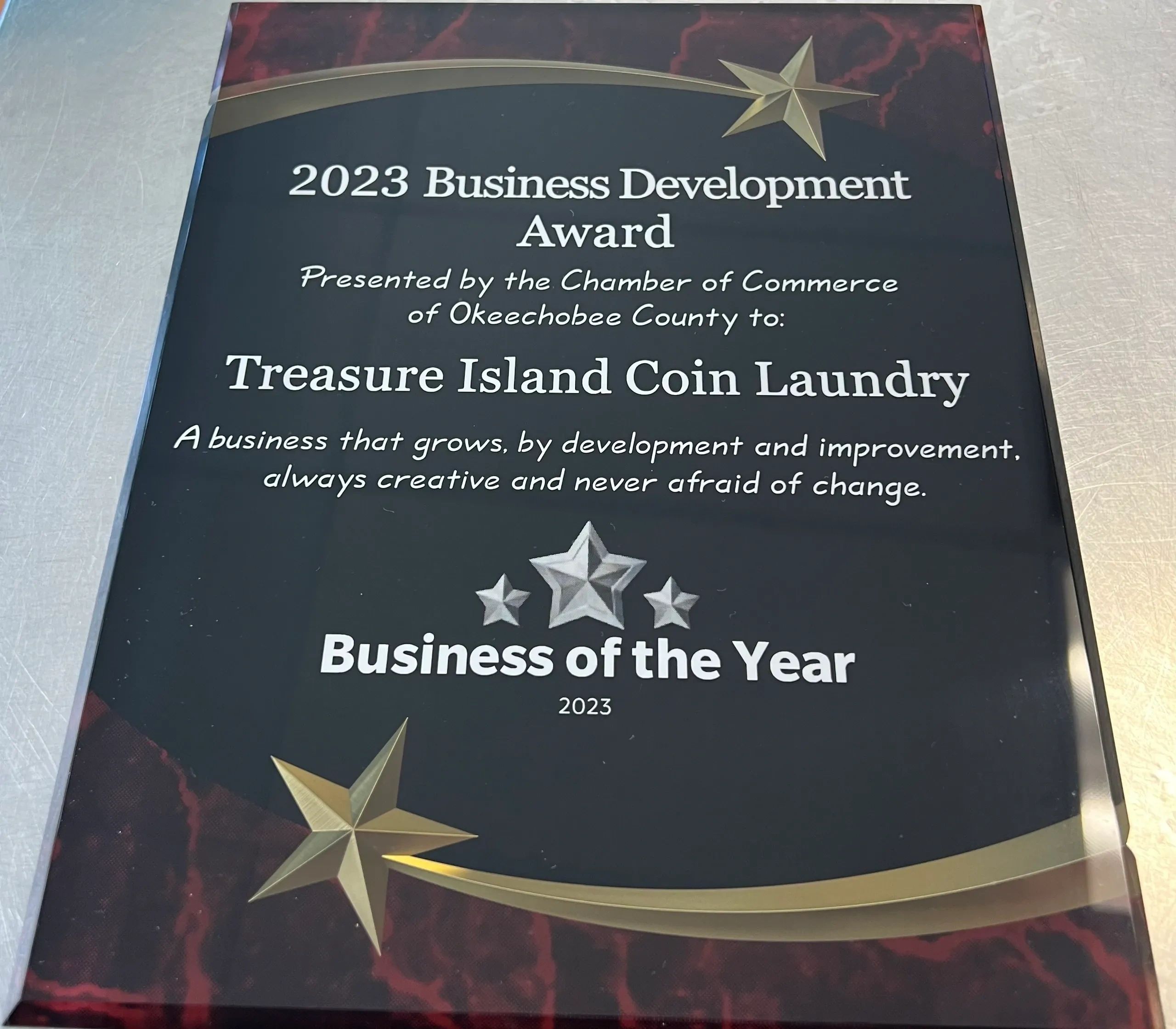 2023 Business Development Award plaque for Treasure Island Coin Laundry.