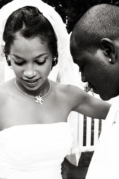 Black and white photo of an intimate wedding moment.