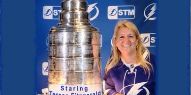 Teresa Fitzgerald with the Stanley Cup promoting her sports talk show.