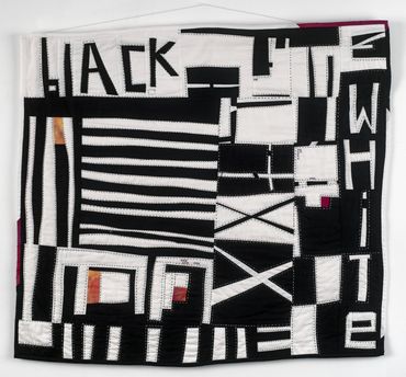 It's Not All Black and White. 
Improvisational quilt, hand quilted. 
33" x 30"
