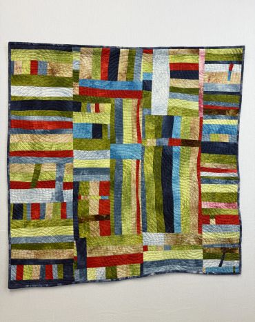 Running in Circles. Hand dyed fabrics. Improv piecing. Machine quilted. 36" x 36"