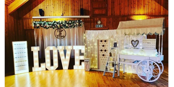 White Wedding hire package with 4ft light up love letters, sweetcart, postbox, donut prosecco wall