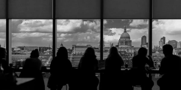 A meeting in a room overlooking the Capitol building