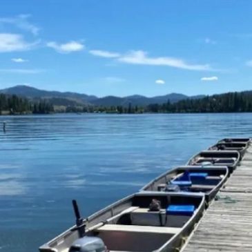 Fishing boats docked on beautiful lake