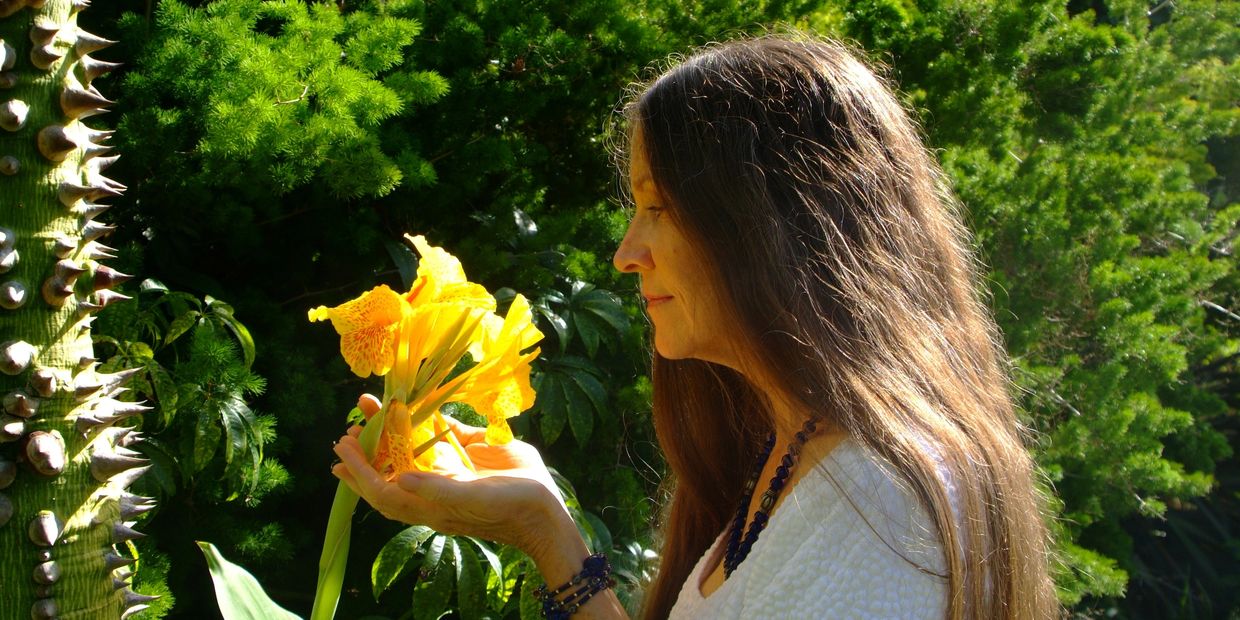 Victoria looking at a flower.