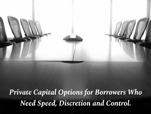 Empty conference room with text about private capital options for borrowers.