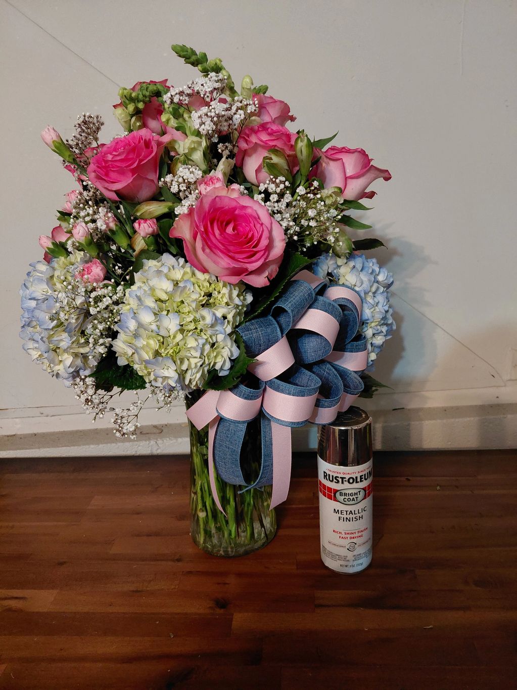 Mixed cut vase arrangement with at least 3 different types of blooms.