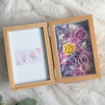 Wooden frame with preserved colorful flowers on the right side.