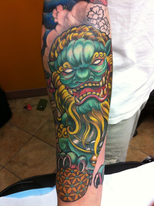 Foo dog forearm tattoo 