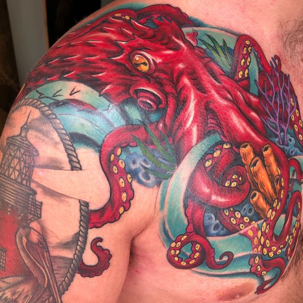 Half chest tattoo featuring a vibrant and colorful octopus