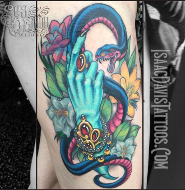 Neotraditional witch’s hand and snake tattoo