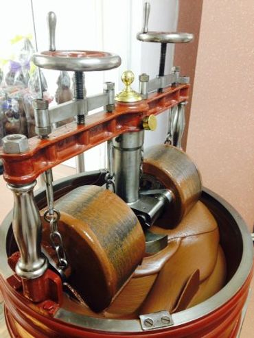 Close-up of a vintage mechanical device with metal and wooden components.