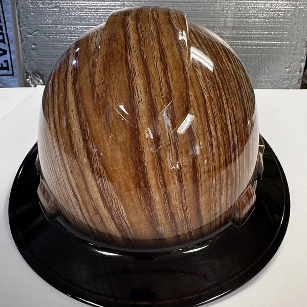 Hard hat with wood grain finish and black brim.