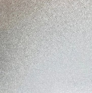 Close-up of a rough textured grey surface.