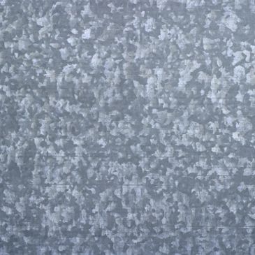 Close-up of a galvanized metal surface.