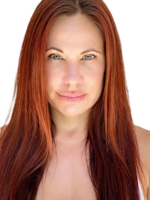 Portrait of a woman with long red hair and blue eyes.