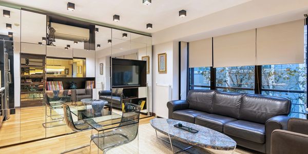 Furnished living room with sofa and dining area in an apartment for rent at Deger 16, Nişantaşı