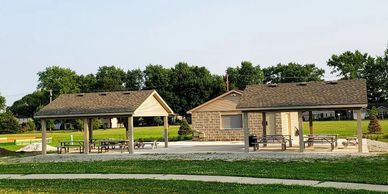 Outdoor pavilion, covered picnic tables, concession building, walking path at Huntertown Family Park
