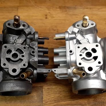 Side by side of Bing Carbs BMW to illustrate before and after vapor blasting