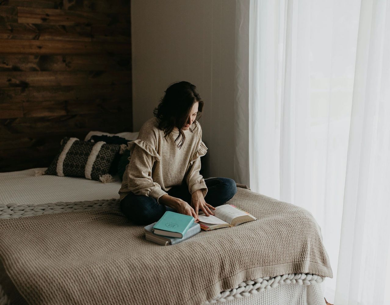 woman reading her bible in a peaceful setting