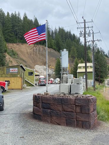 American flag at a concrete supply yard.