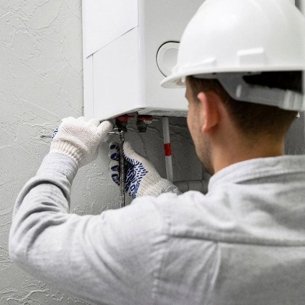 Technicians performing AC Repair in Circle Pines by servicing an outdoor air conditioner for reliabl