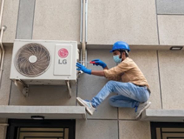 Technicians performing AC Repair Forest Lake by servicing an outdoor air conditioner for fast reliab
