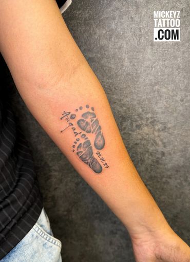 baby foot print tattoo at mickeyz tattoo studio