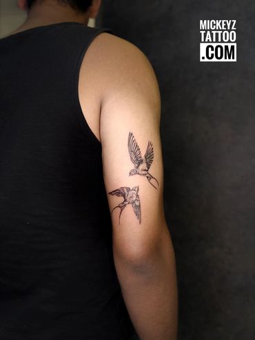 Beautiful swallow arm tattoo created at Mickeyz tattoo studio, the best tattoo studio in Mumbai.