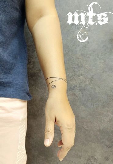 Beautiful bracelet tattoo custom inked at Mickeyz Tattoo Studio, the best tattoo studio, Mumbai