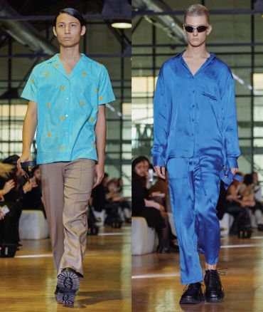 Two male models walking a fashion runway in vibrant outfits.