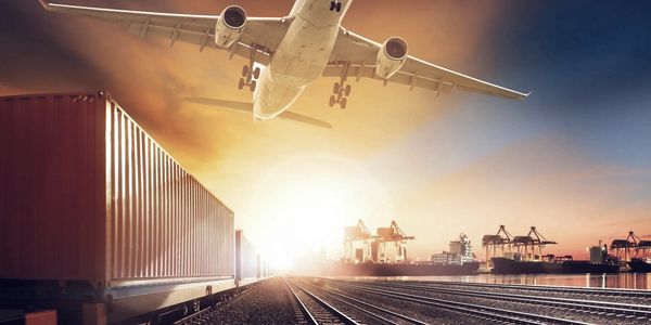 An airplane flying over railroad