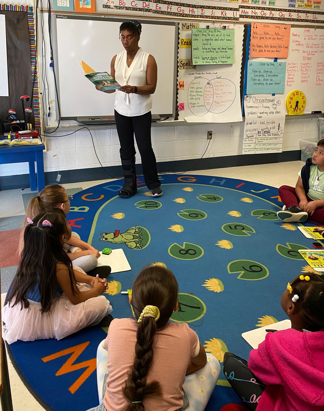 Reading to first grade summer campers.